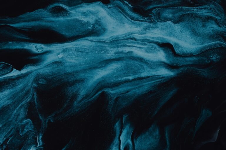 Abstract dark teal fluid texture representing middle-market M&A preparation complexity